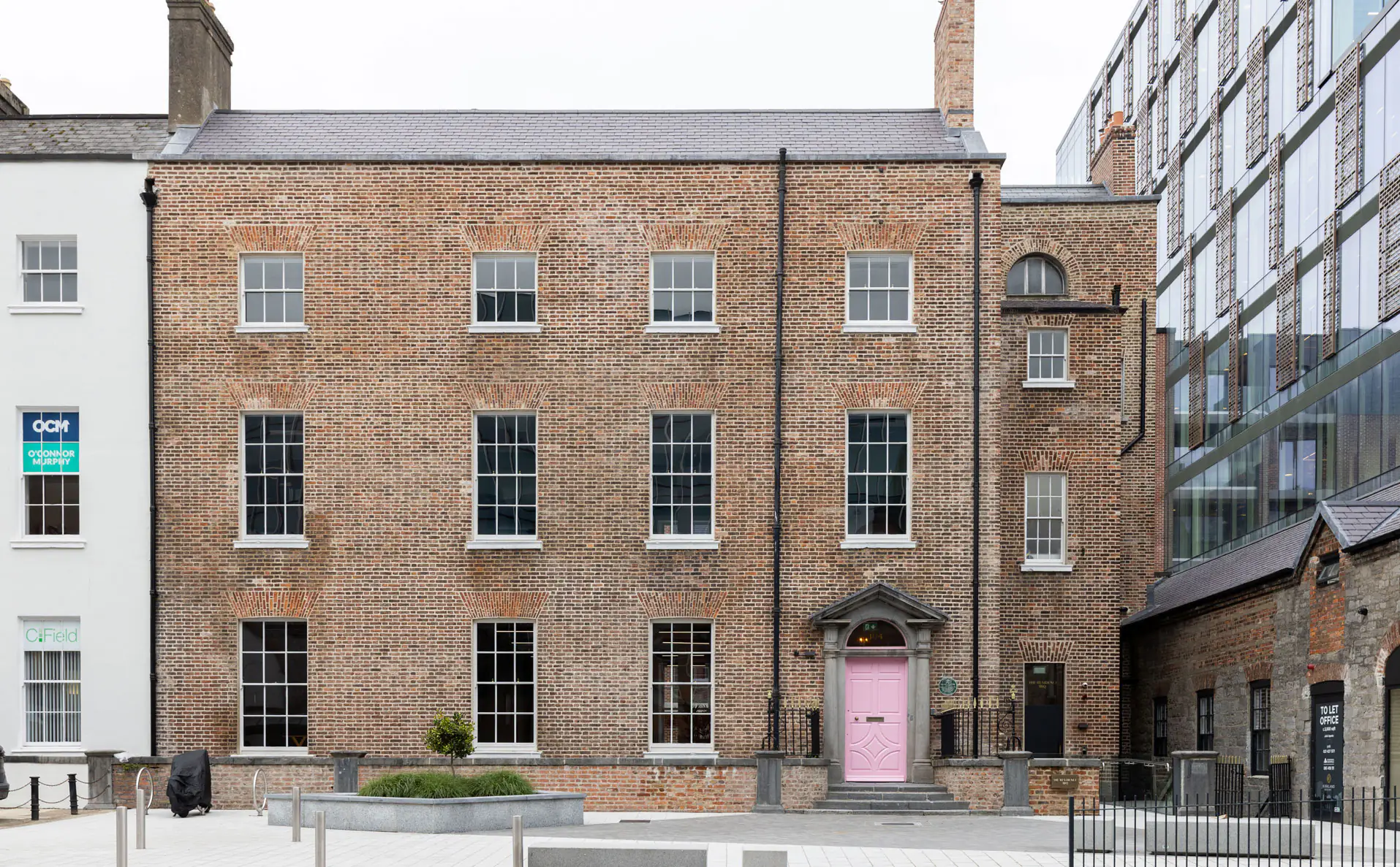The Palace, the restored red-brick Georgian Bishops’ Palace on Henry Street, Limerick, with its pink front door
